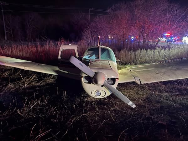 Two people were hospitalized after a plane crashed into an open field Friday night